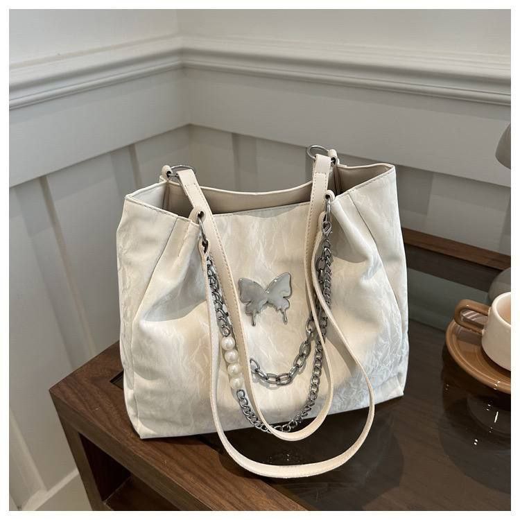 Elegant White Ladies Bag with Butterfly Charm & Chain Accent